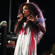SZA performing at the Grammys / Image via Getty